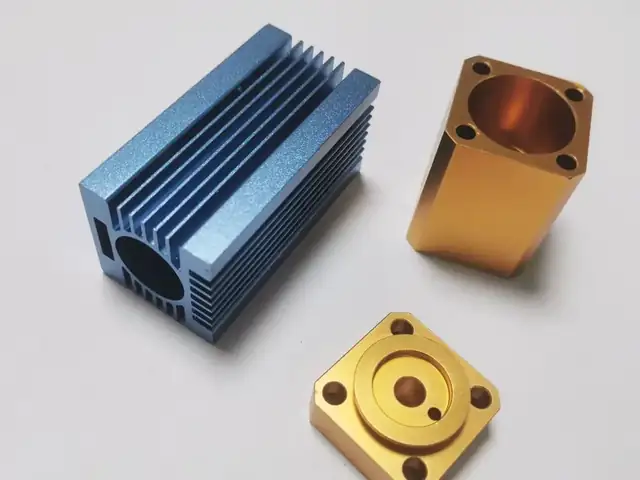 Anodised aluminium — blue heat sink and gold-anodised blocks, milled then finished