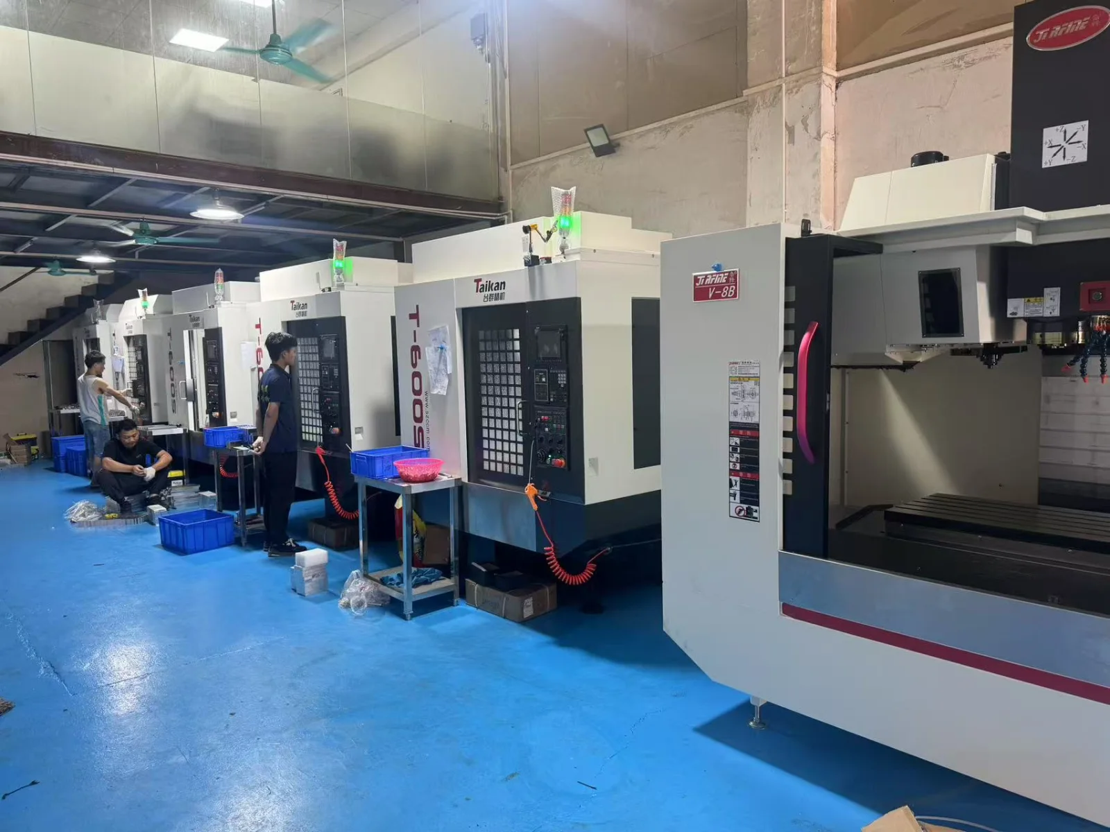 Row of vertical machining centers on the GY Machining shop floor